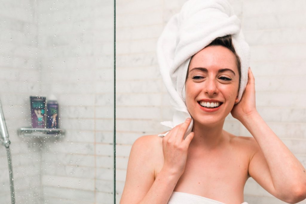 photo of woman washing her hair