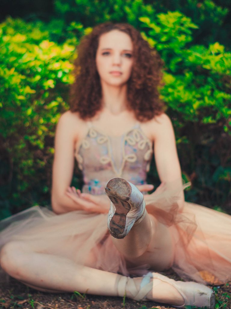 Photo of ballerina with curly hair